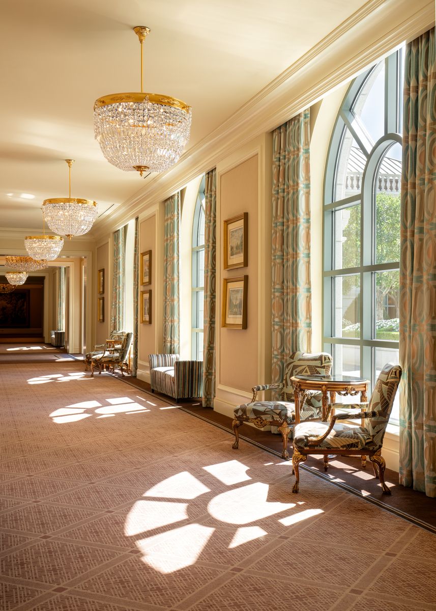 Hallway at Grand America Hotel showing beautiful windows and stunning chandelier.