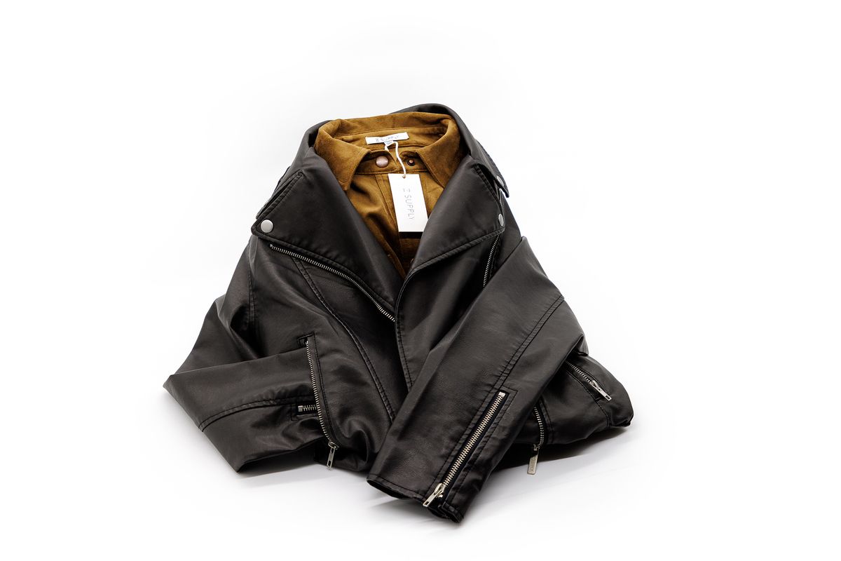 Black leather jacket with dark yellow button-up shirt from Z Supply
