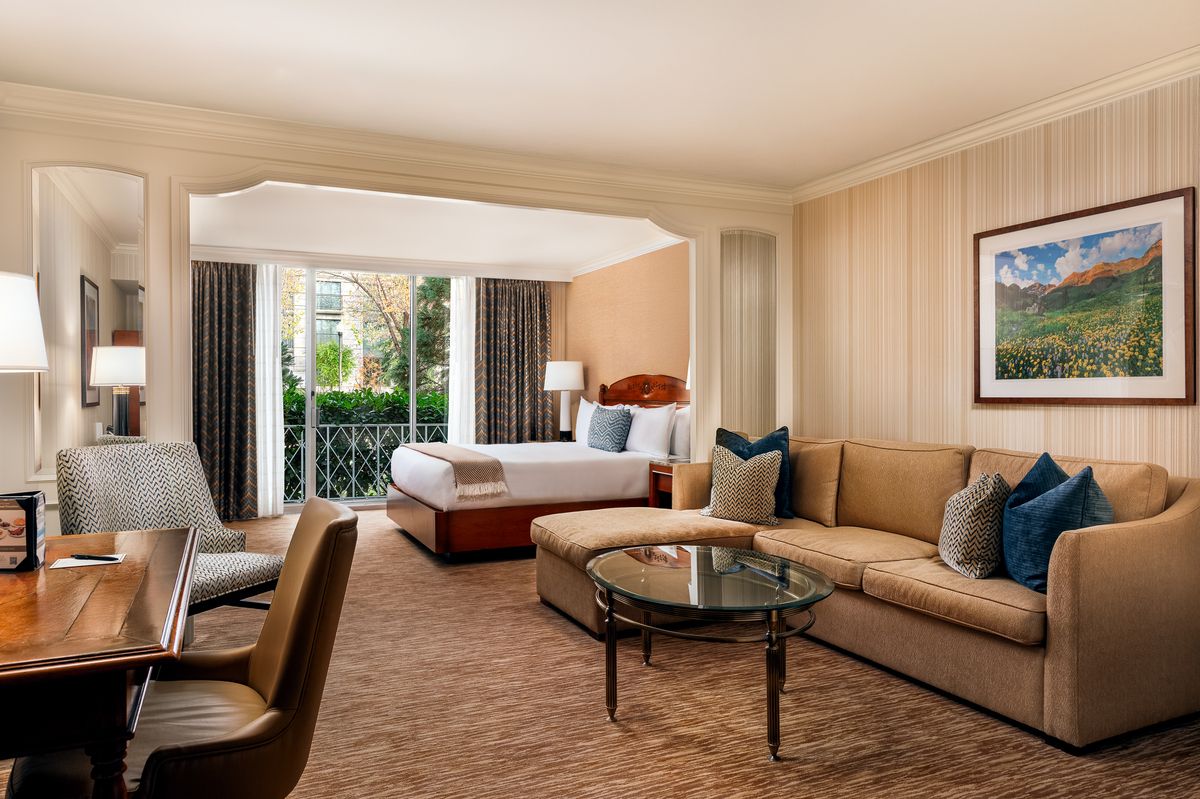 Little America Salt Lake City Garden Room with one King bed, couch, and desk