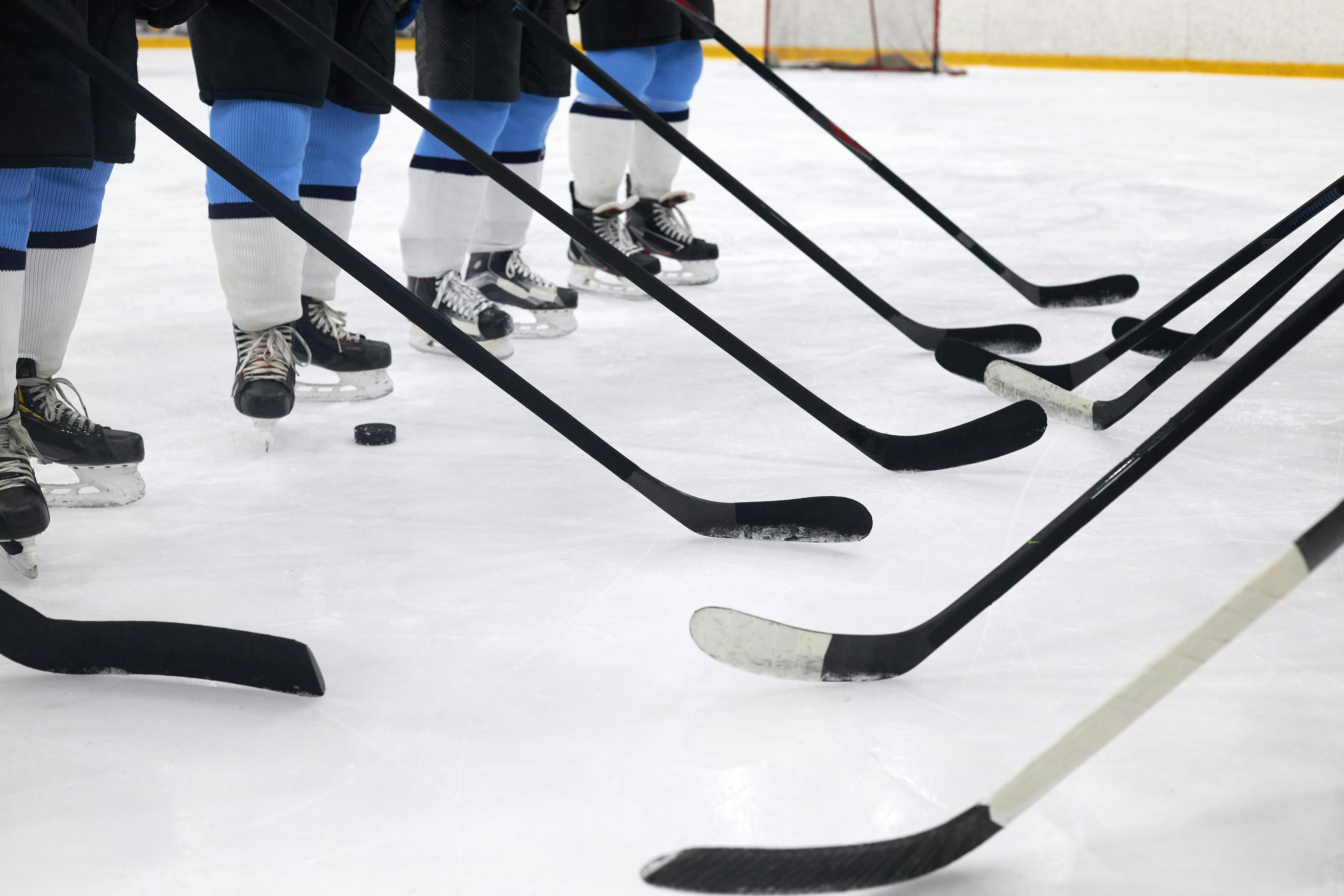 Hockey skates, pucks, and sticks